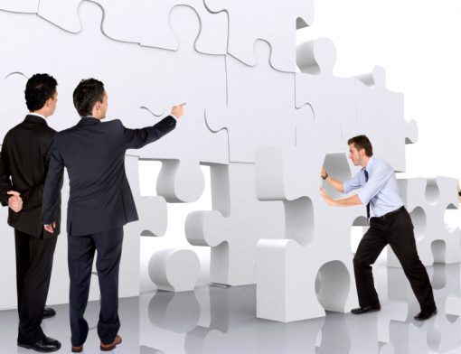 business-teamwork-business-men-making-a-puzzle