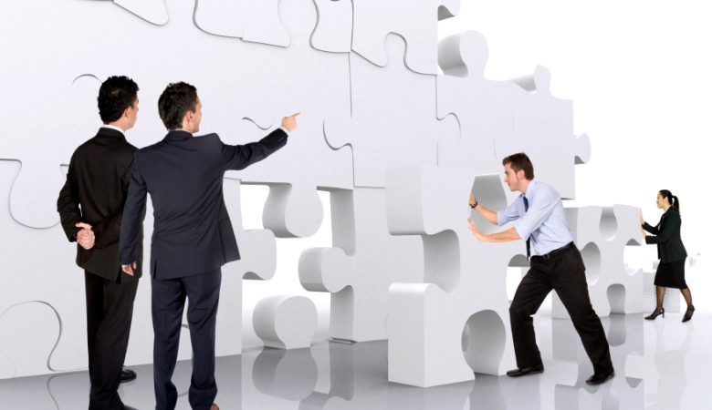 business-teamwork-business-men-making-a-puzzle