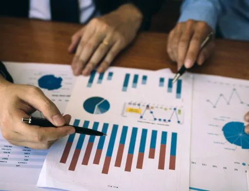 two-business-partnership-coworkers-analysis-strategy-with-discussing-a-financial-planning-graph-and-company-budget-during-a-budget-meeting-in-office-room