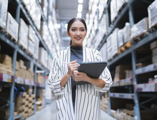 portrait-of-asian-woman-business-owner-using-digital-tablet-checking-amount-of-stock-product-inventory-on-shelf-at-distribution-warehouse-factory-logistic-business-shipping-and-delivery-service