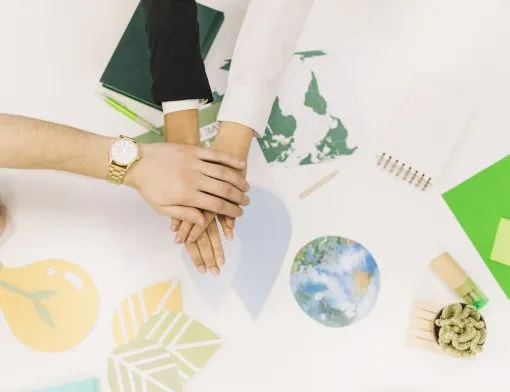 group-businesspeople-stacking-their-hands-desk